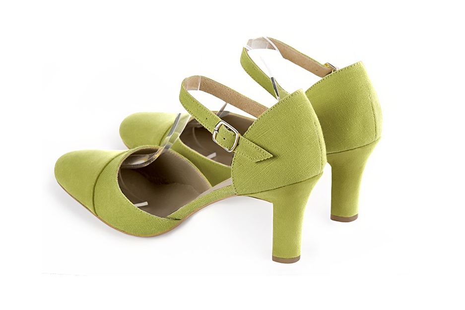Women's pistachio green open side dress shoes, with an instep strap. Round toe. High kitten heels - Rear view